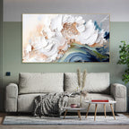 Living room with a gray sofa, small table, and abstract floral painting on the wall.