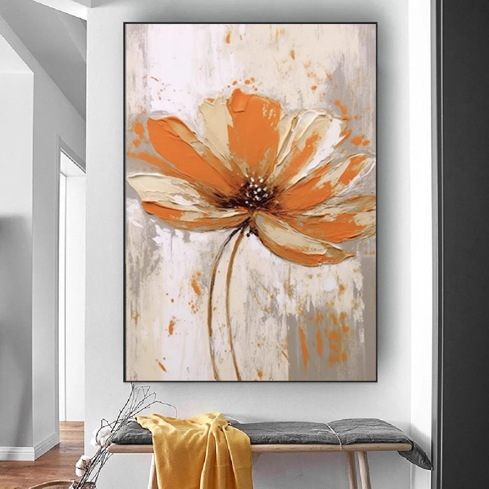 Framed abstract painting of an orange flower on a wall above a bench.
