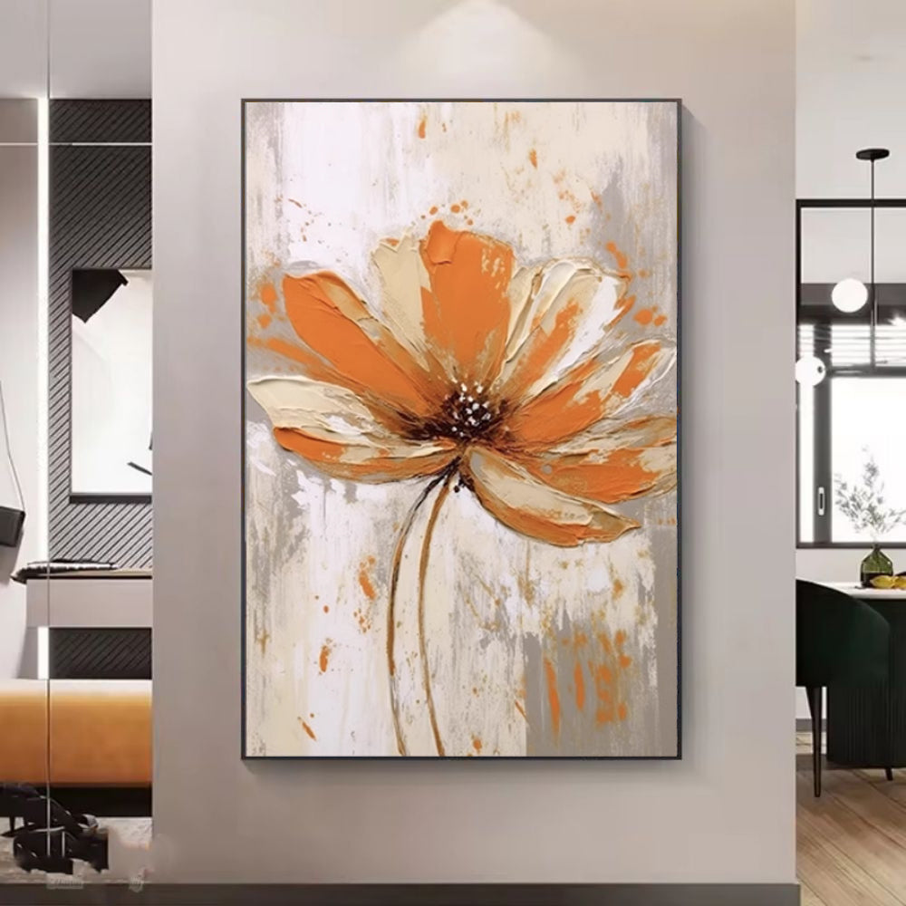 Abstract painting of a flower with orange and beige colors on a wall.