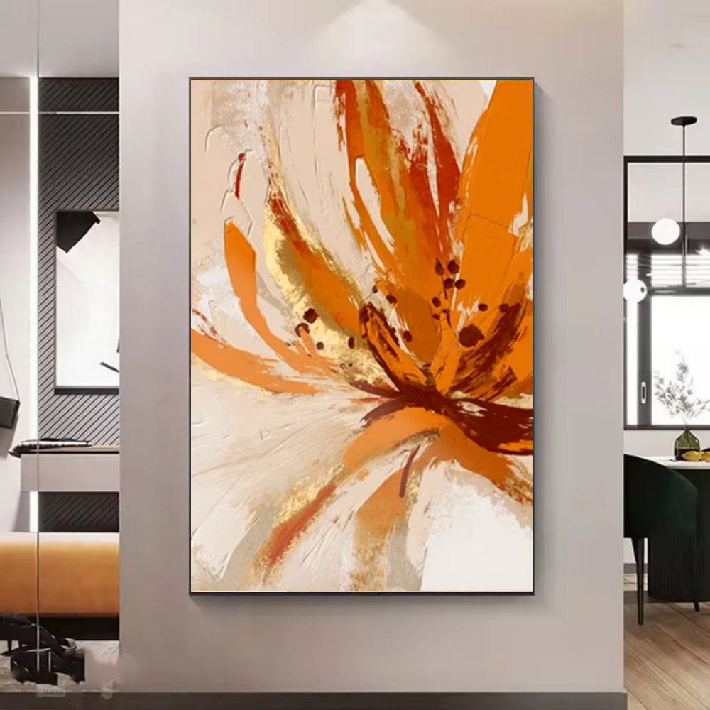 Abstract art painting with orange and beige colors on a wall in a modern interior setting.