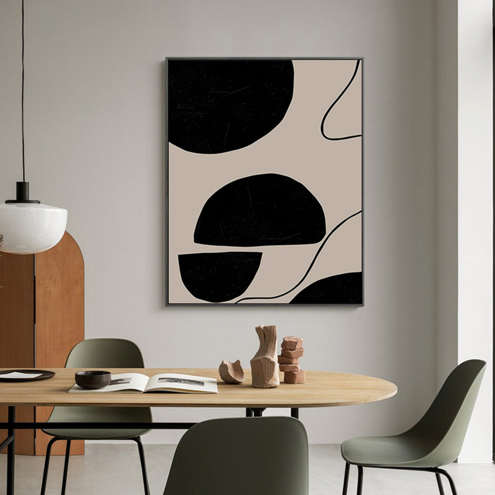 Dining room with abstract art on the wall, table, and chairs.