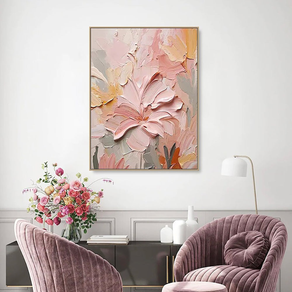 Textured floral canvas wall art hanging in modern living room above pink accent chairs