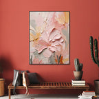 Hand painted floral canvas art work on a red wall with a wooden bench and cacti.