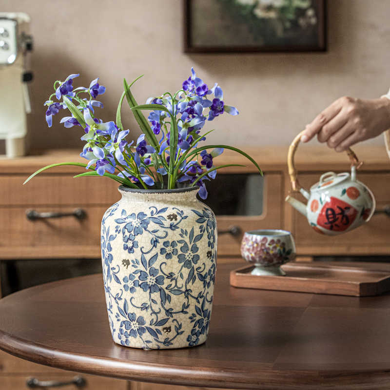 Ice-cracked ceramic vase with traditional blue-and-white porcelain floral detailing