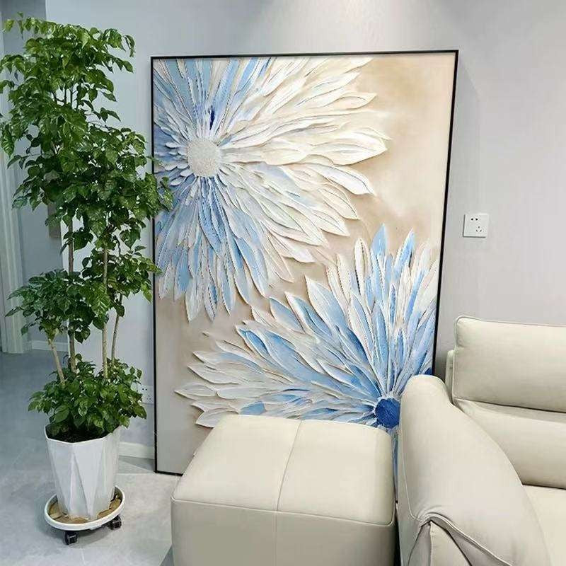 Decorative floral painting in a living room with a plant and sofa.