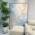 Decorative floral painting in a living room with a plant and sofa.