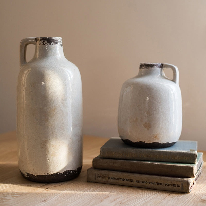 Rustic ceramic vases in two sizes featuring coarse pottery texture