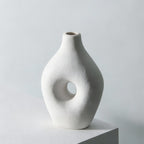 White textured vase with dimensions indicated on a gray background