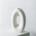 White abstract vase with measurements on a light gray background