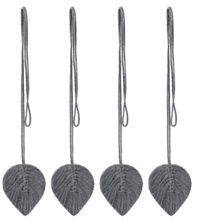 Four gray leaf-shaped ornaments with strings on a white background