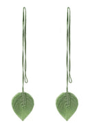 Pair of green leaf-shaped earrings on a white background