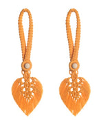 Orange earrings with heart-shaped designs on a white background