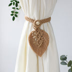 Macrame curtain tieback with leaf design on a white curtain