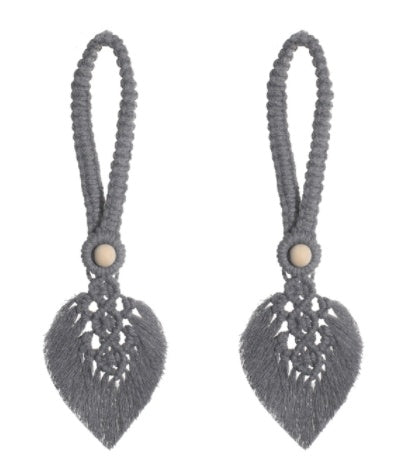 Gray tassel earrings with leaf-shaped designs on a white background