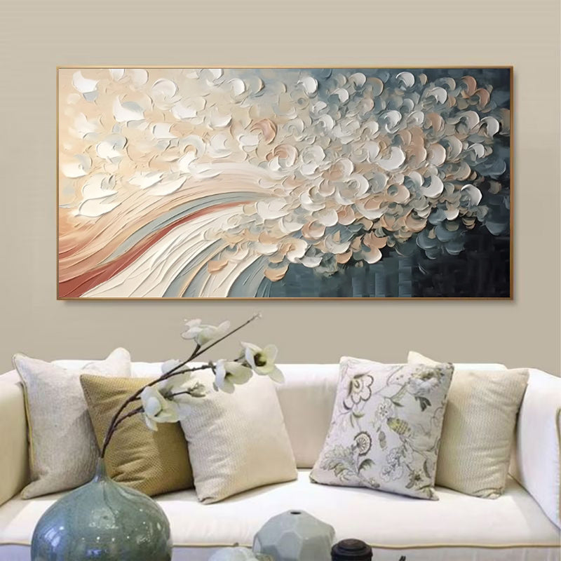 Abstract wall art above a sofa with decorative pillows
