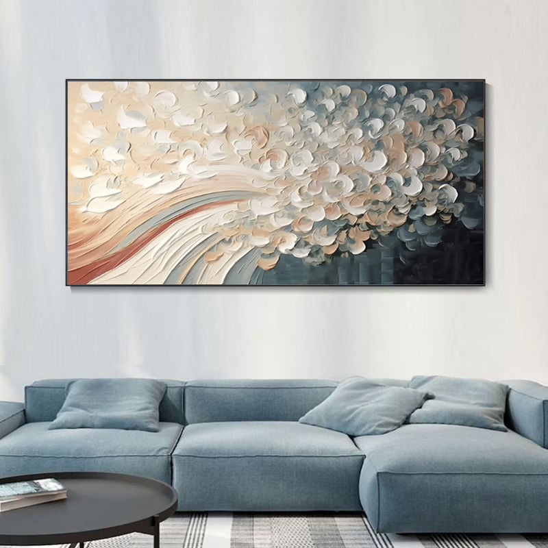 Abstract wall art above a blue sofa in a living room