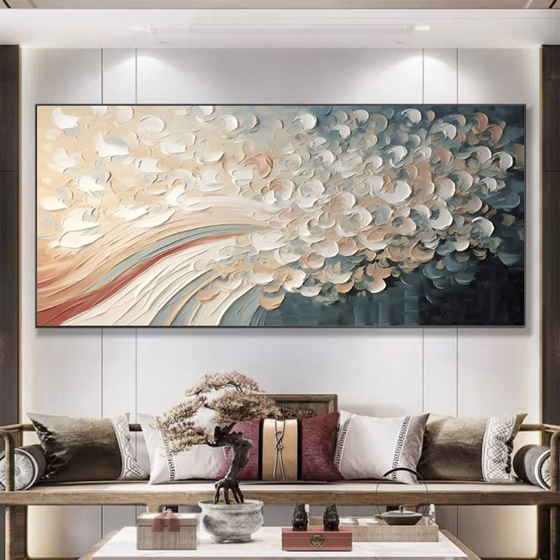 Abstract wall art in a living room with a sofa and decorative items.