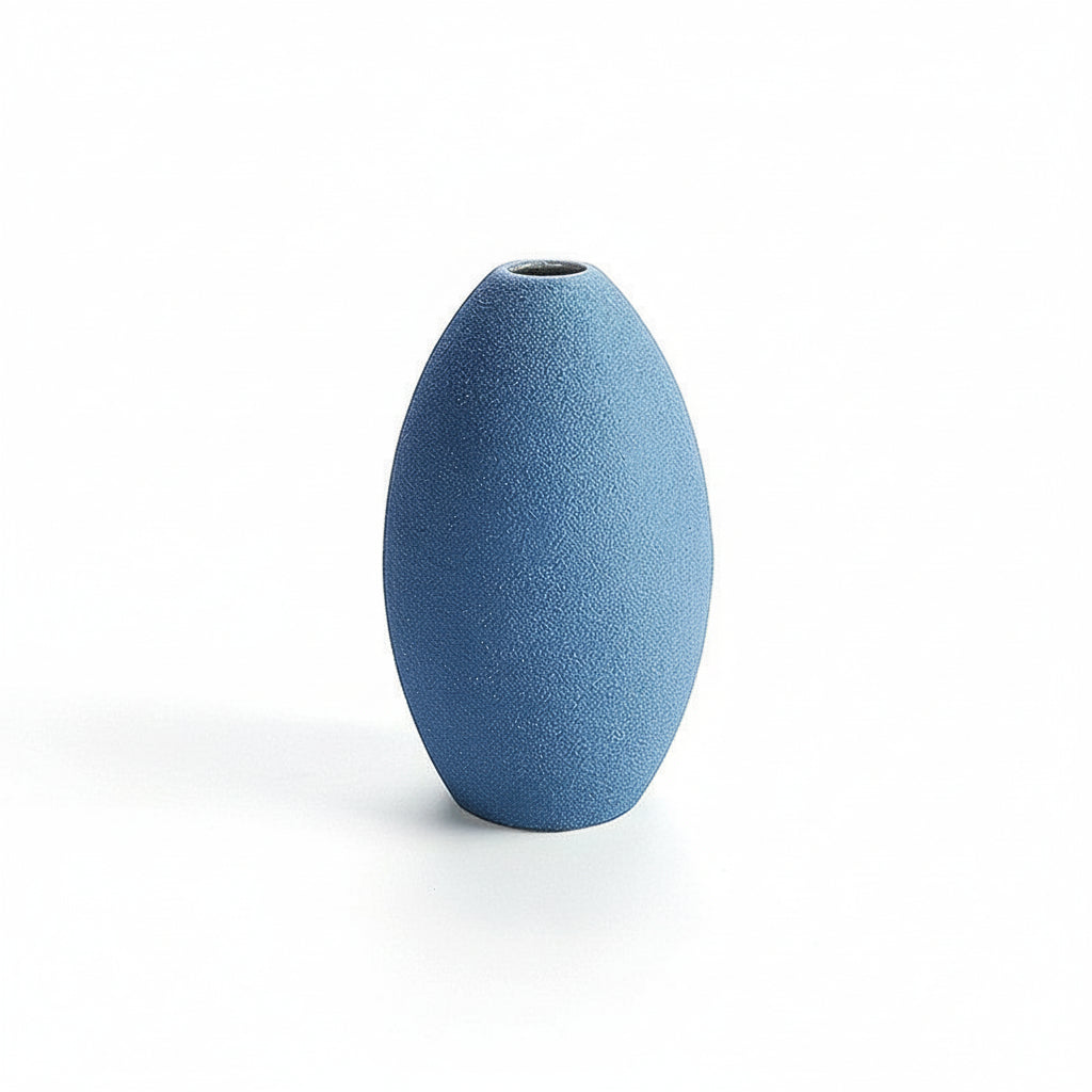 Blue textured vase with a measurement scale on a white background