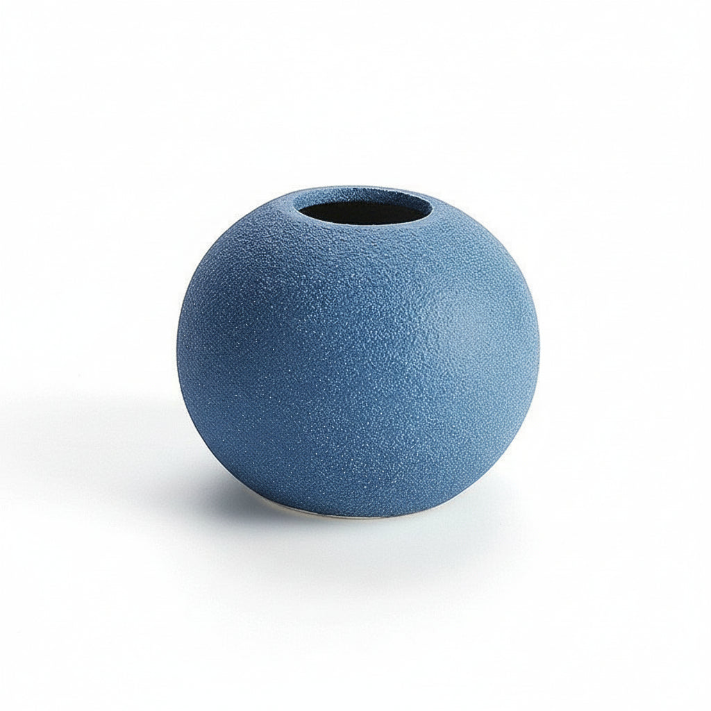 Blue spherical vase on a white background with measurement lines.