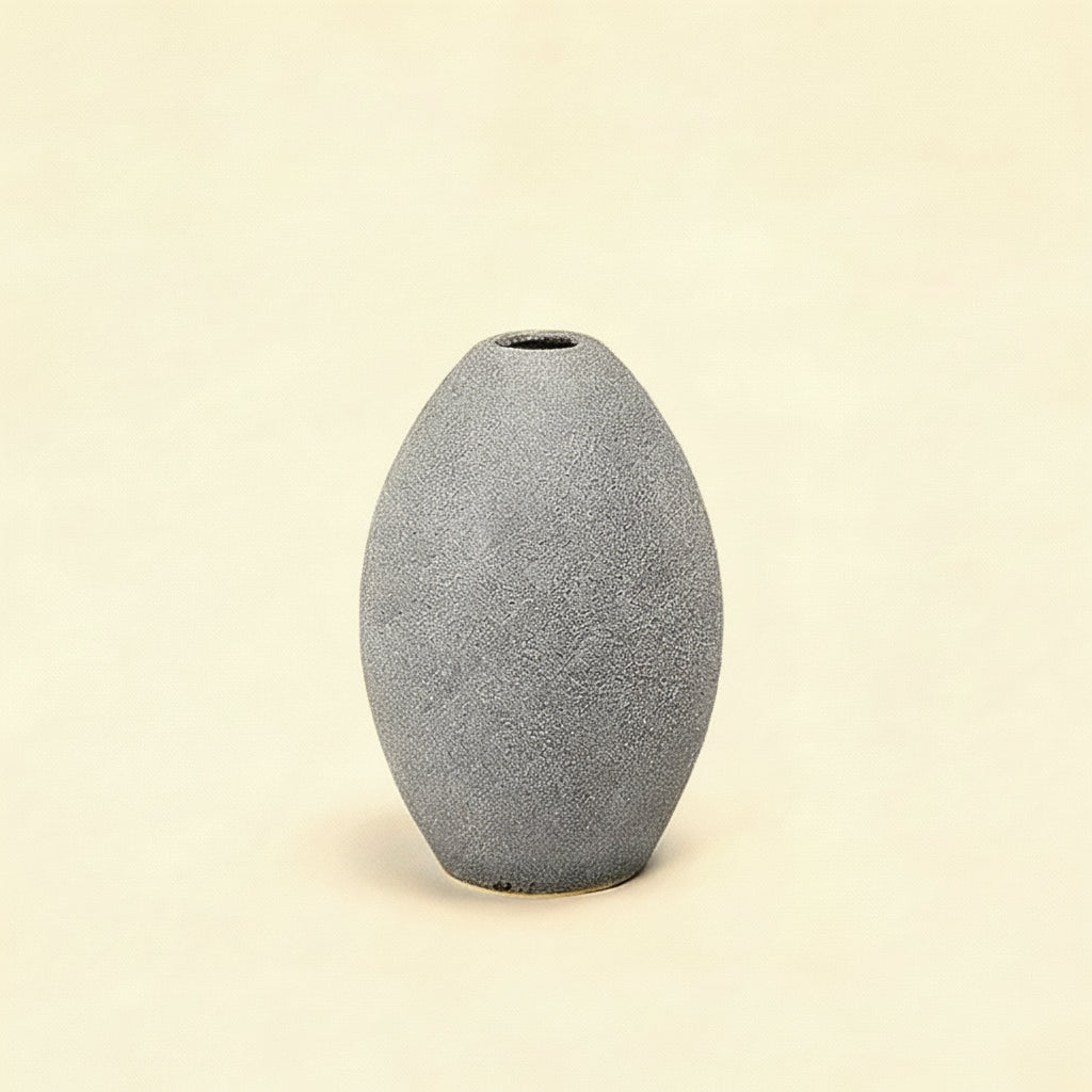 Gray textured vase on a white background with measurement lines.