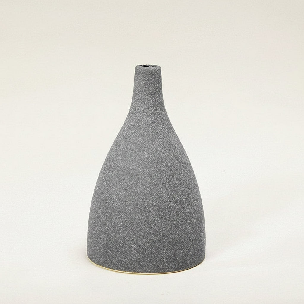 Gray textured vase with measurement lines on a white background