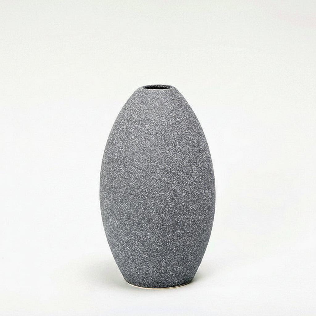 Gray textured vase on a white background with measurement lines.