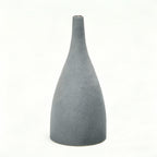 Gray textured vase on a white background with measurement lines.