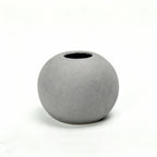 Gray spherical vase with dimensions indicated on a white background