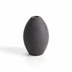 Gray textured vase with measurement lines on a white background