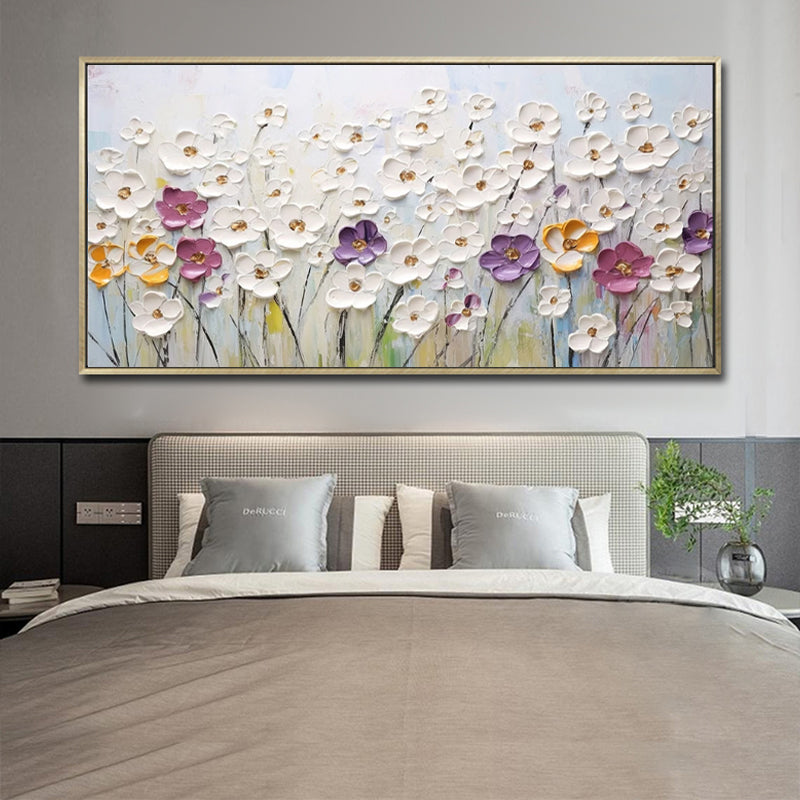 Floral painting above a bed in a bedroom setting