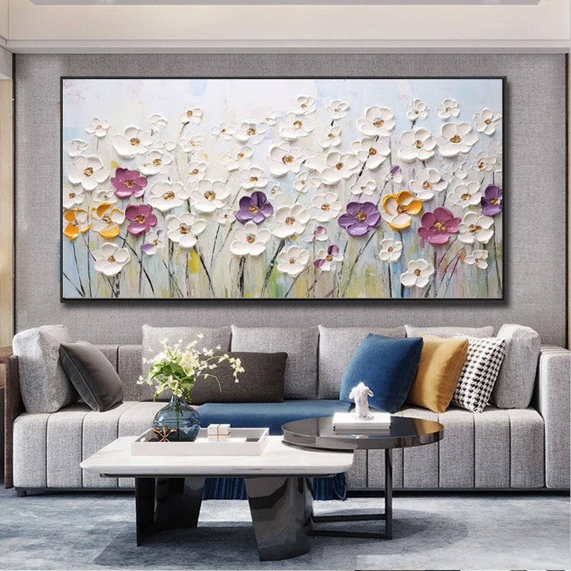 Living room with a large floral painting above a gray sofa.