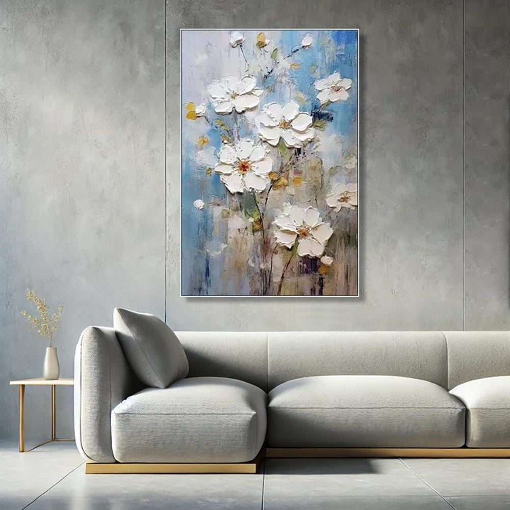 Abstract floral painting on a gray wall above a modern sofa.