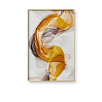 Abstract art print with swirling colors in a gold frame on a white background