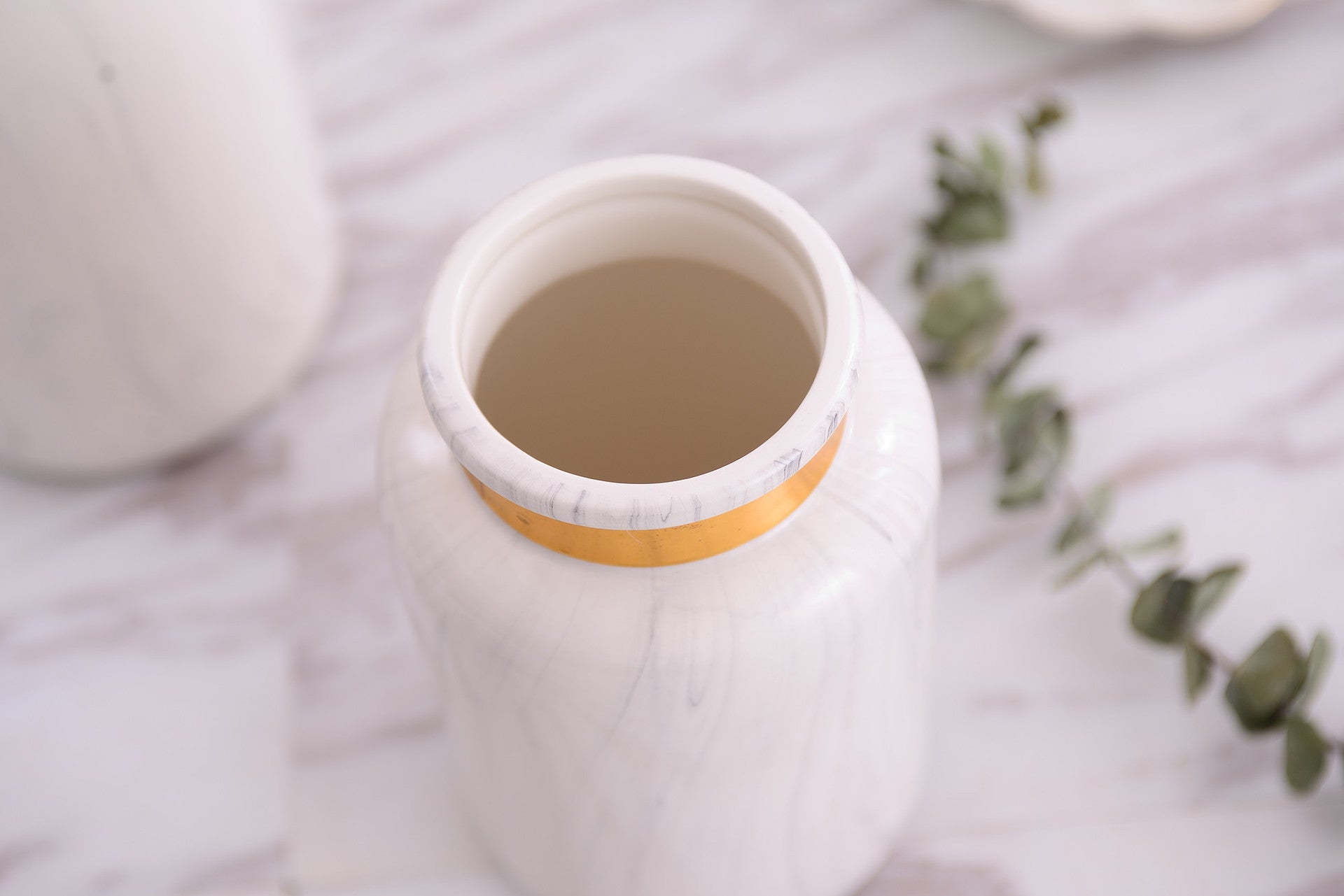 Decorative marbled porcelain vase with gold accents for modern home décor