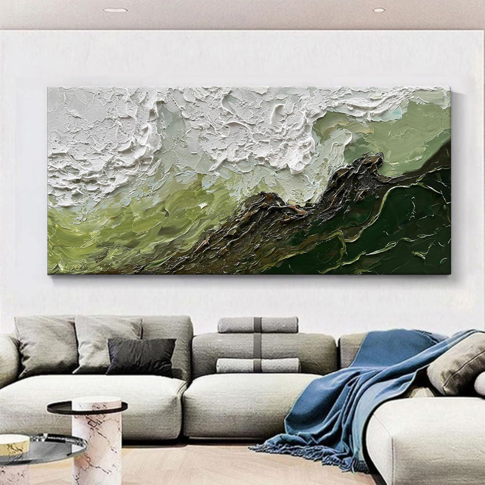 Abstract painting on a wall above a sofa in a living room