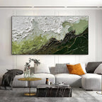 Living room with a large abstract painting on the wall, a sofa with decorative pillows, and a coffee table.