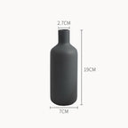 Black vase with dimensions labeled on a white background