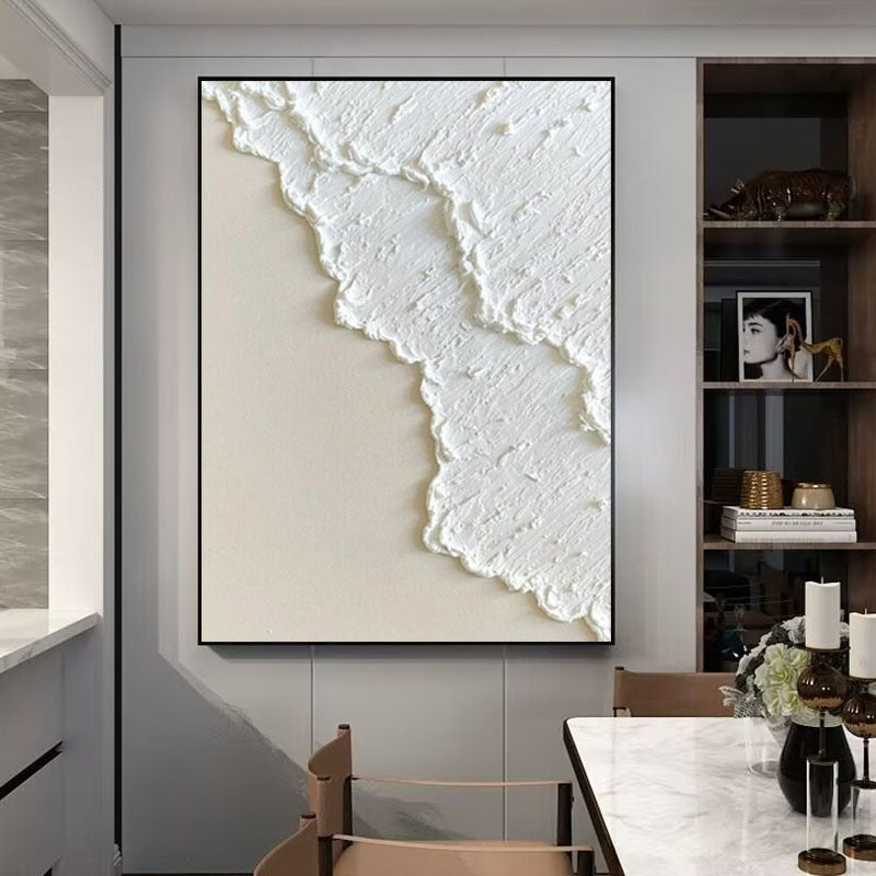 Abstract wall art in a modern interior setting with a dining table and chairs.