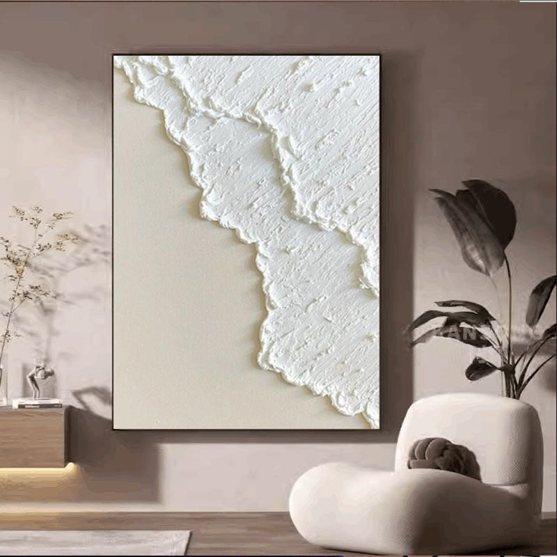 Abstract textured wall art in a modern interior setting with plants and furniture.
