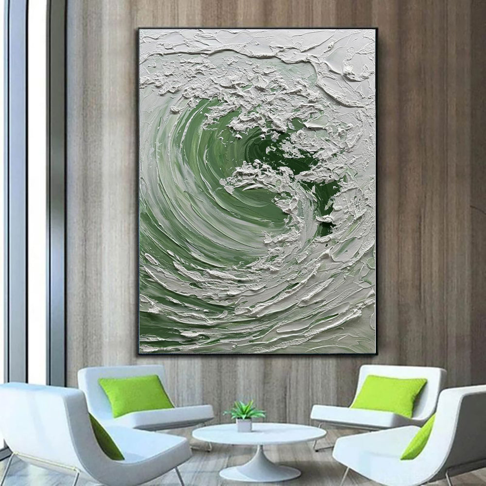 Abstract art piece on a wall in a modern living room with white chairs and green cushions.