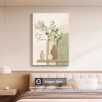Decorative wall art with floral elements and text above a bed in a bedroom setting.