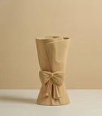 Nordic ceramic beige vase with sculpted bow detail and soft glazed finish