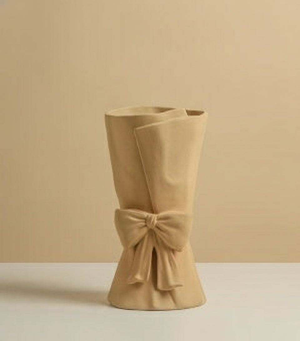 Nordic ceramic beige vase with sculpted bow detail and soft glazed finish