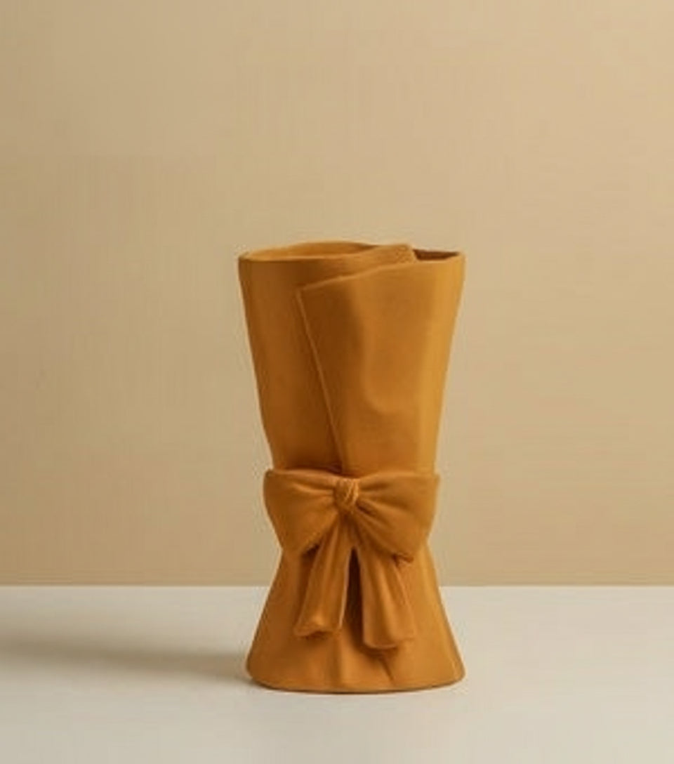 Mustard yellow handcrafted floral vase with minimalist Nordic design and ribbon accent