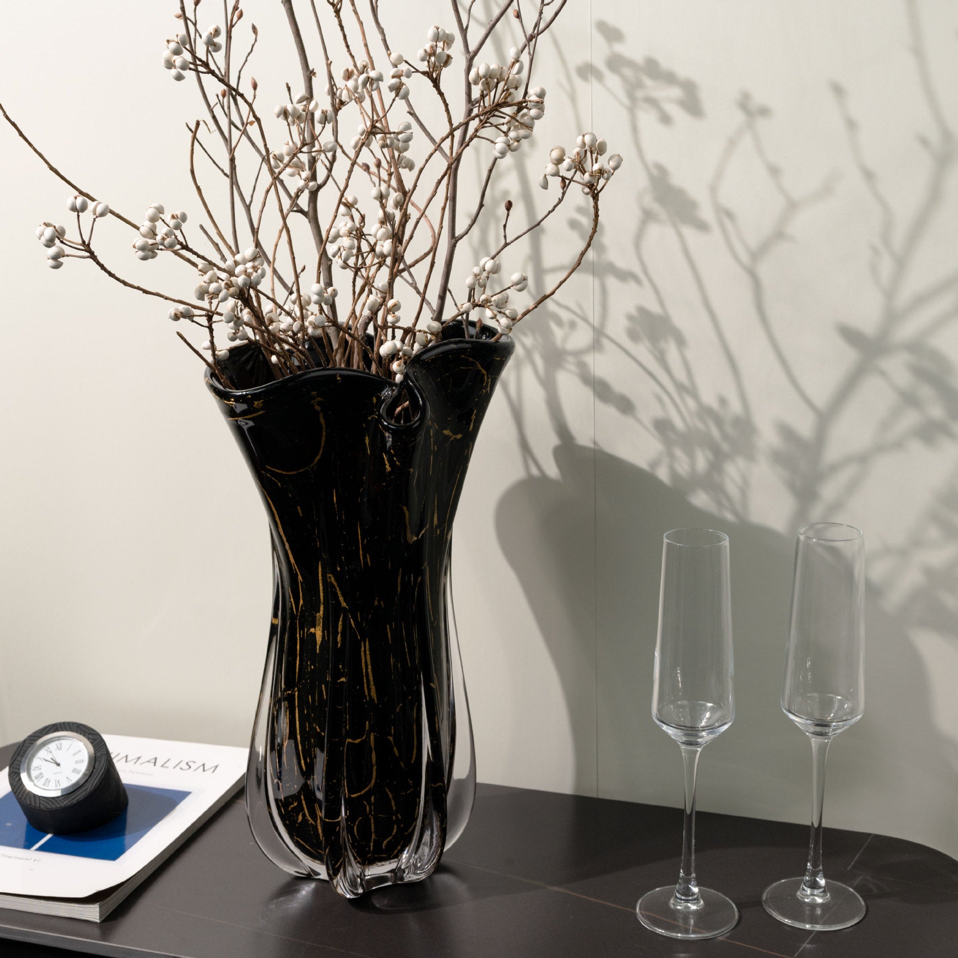 Luxury black glass vase with metallic gold veining and organic ruffled rim