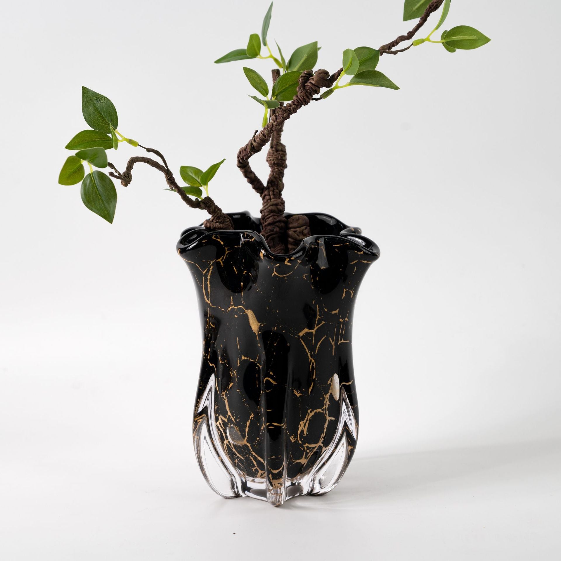 Small black and gold marbled glass vase with sculpted wavy opening