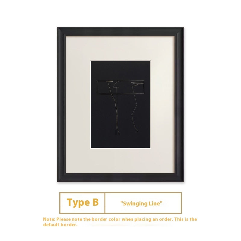 Framed artwork with a black line drawing on a white background