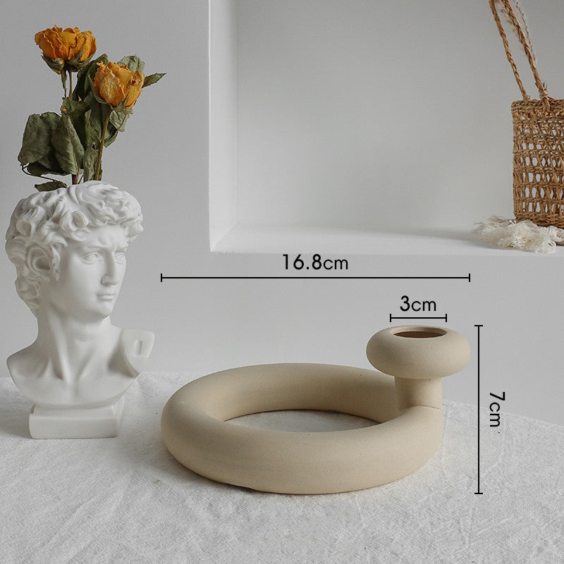 Ceramic ring-shaped Raw unglazed vase with subtle artisan detailing 