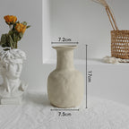 Beige natural ceramic table vase with understated design for dried florals
