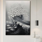 Black and white abstract wave painting on a wall
